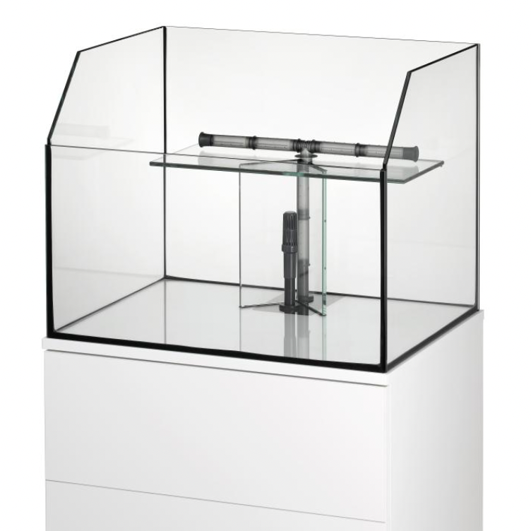 A clear glass fish tank with a black frame, featuring a glass divider and a central pump entry, mounted on a white cabinet against a white background.